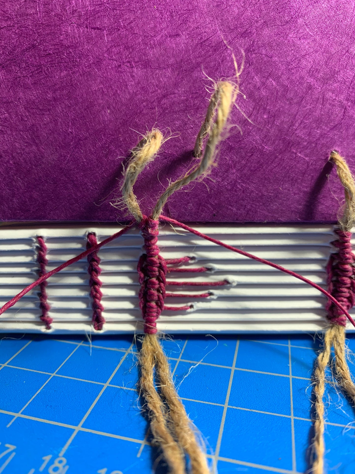 Raised Cord Sewing with Icicle Spine Stiches Covered in Purple Handmade Paper